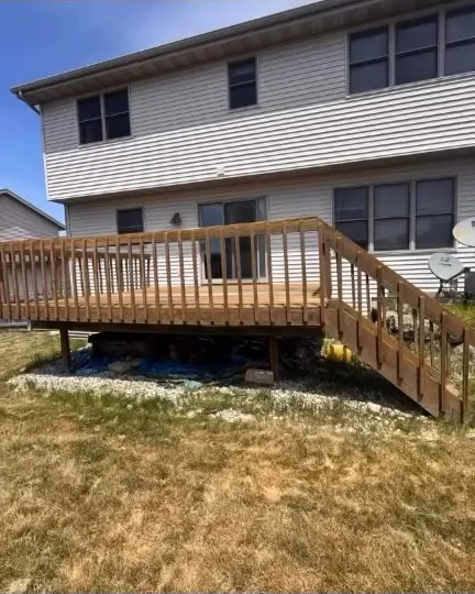 Faded backyard deck before staining