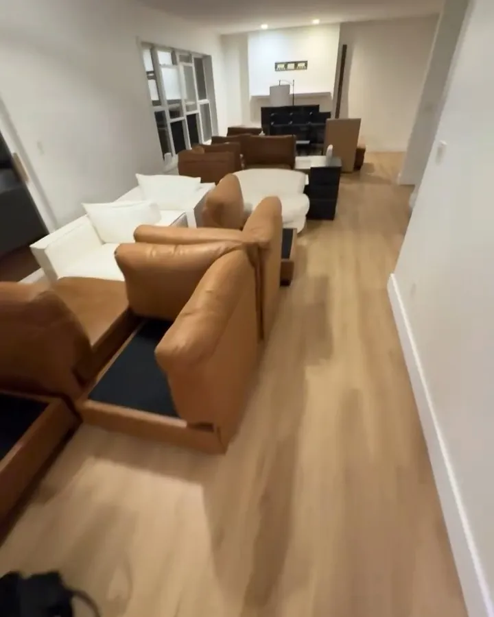 New LVP flooring and baseboards in a living room