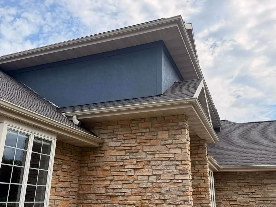 Two-story stucco home after exterior painting in the Madison area